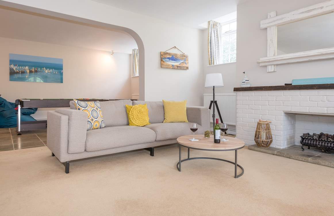 This open plan layout is well suited for entertaining and cosy with the open coal-effect gas fire.