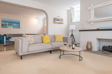 This open plan layout is well suited for entertaining and cosy with the gas-effect open fire.