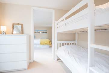 The bunk bedroom is just off the kitchen and leads on to the twin bedroom...
