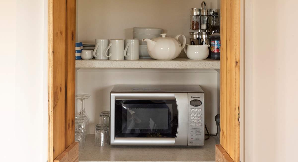 The kitchen has a hidden cupboard full of equipment.