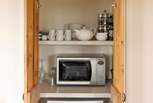 The kitchen has a hidden cupboard full of equipment.