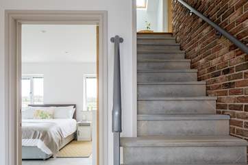Beautiful stone steps lead from the front door to the rest of this reverse-level barn.