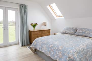 Bedroom 2 on the first floor has a king-size bed, en suite bathroom and lovely views