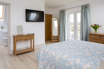 Bedroom 2 has a Juliet balcony and views over the surrounding fields.