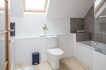 The en suite bathroom for bedroom 2 has a 'p' shaped bath and fitted shower.