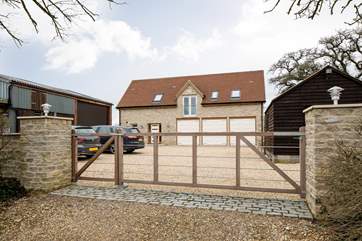 There is plenty of parking for cars and a gate to keep little ones safe. The outlook for Meadows Barn is over lovely countryside beyond its gardens.
