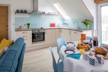 The open plan kitchen/dining/living-room is on the first floor, with lovely views across the surrounding fields.