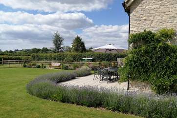 There is a fabulous level lawned garden, a wide terrace and gentle countryside views
