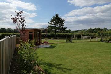 The summer-house at the end of the garden is for guests to enjoy too. This really is a very peaceful setting.