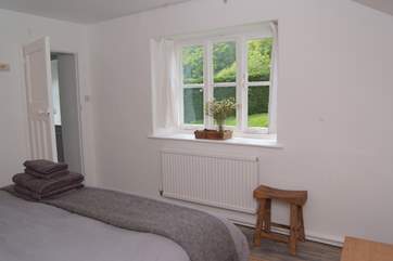 Another view of the double bedroom and a glimpse of its outlook.