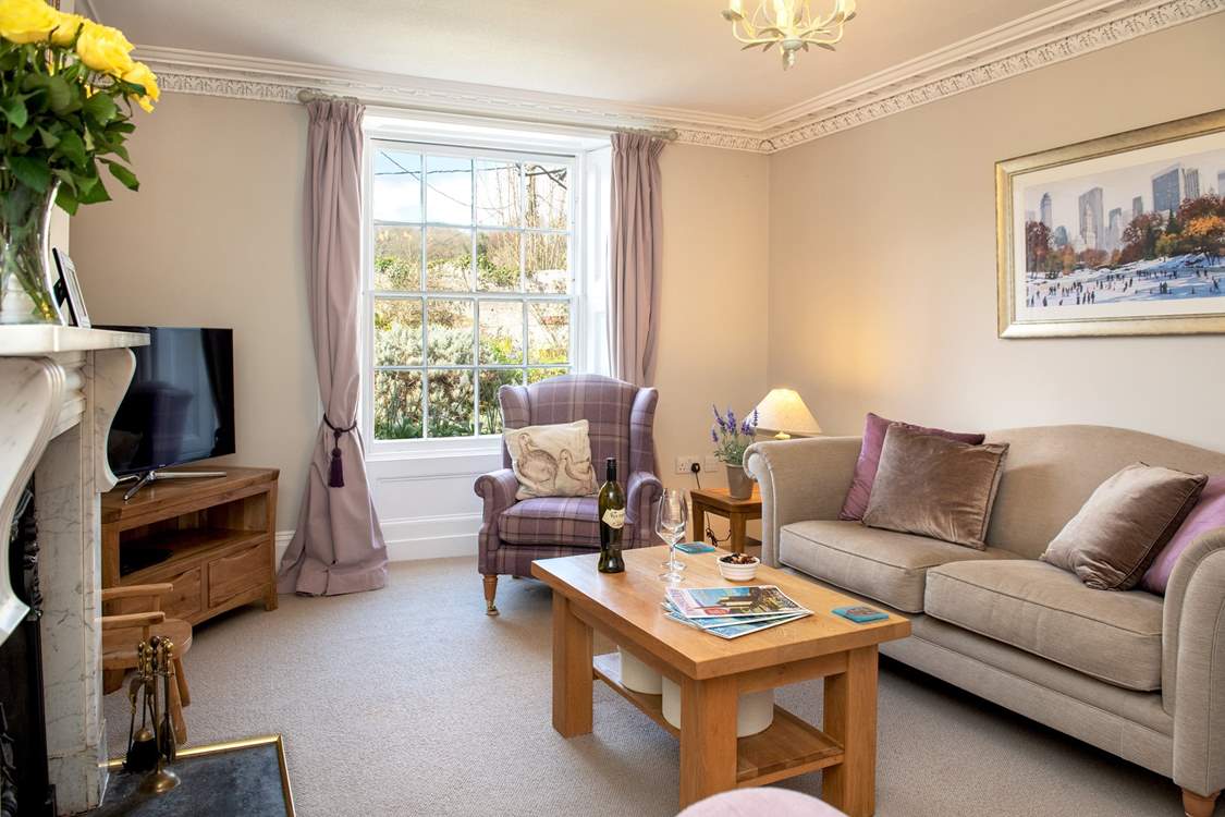 A lovely restful sitting-room in which to unwind and relax.