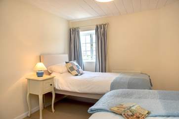 Bedroom 3 is a pretty twin room with views over the garden.