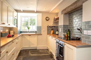 The kitchen cleverly combines modern-day living with the character and charm of the house.