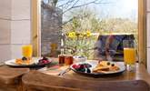 Tuck into a scrumptuous breakfast, taking in the view. - Thumbnail Image