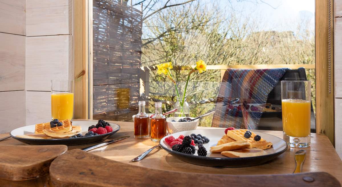 Tuck into a scrumptuous breakfast, taking in the view.