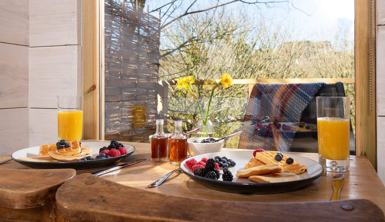 Tuck into a scrumptuous breakfast, taking in the view.