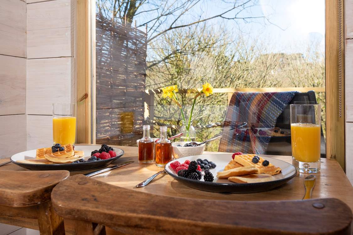 Tuck into a scrumptuous breakfast, taking in the view.