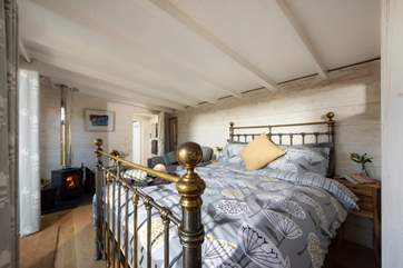 The king-size double bed faces out of the floor-to-ceiling windows, perfect for enjoying the view in complete comfort.
