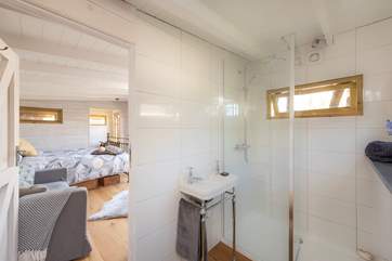The stylish en suite shower-room is at the other end of the cabin, accessed via the living-room.