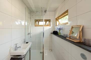 As well as a large walk-in shower cubicle, WC and wash-basin.