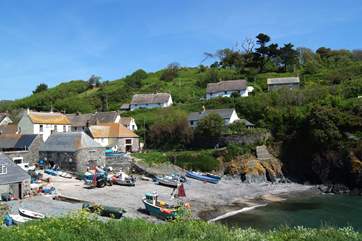 A view of the small beach at Cadgwith from 'The Todden' which divides the cove and is a popular spot with locals and visitors alike.