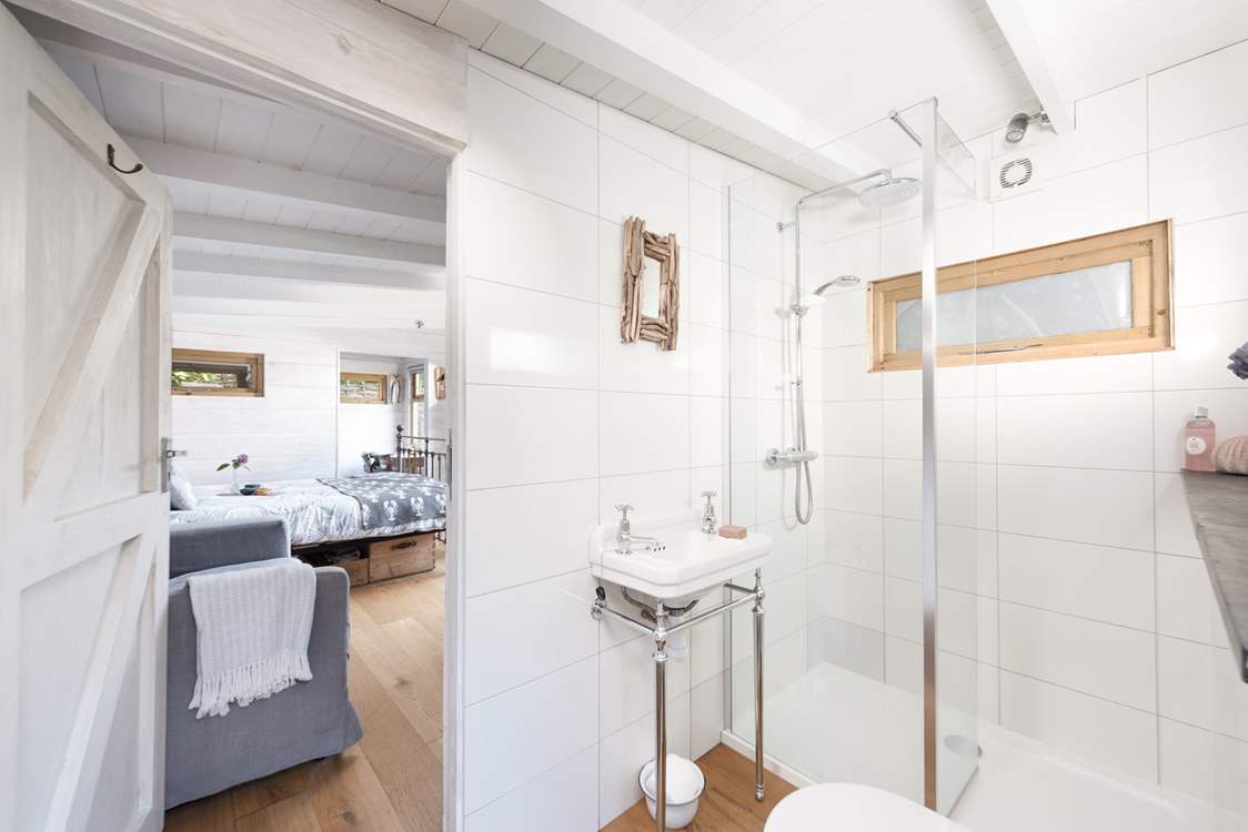 The ensuite shower room is light and airy.