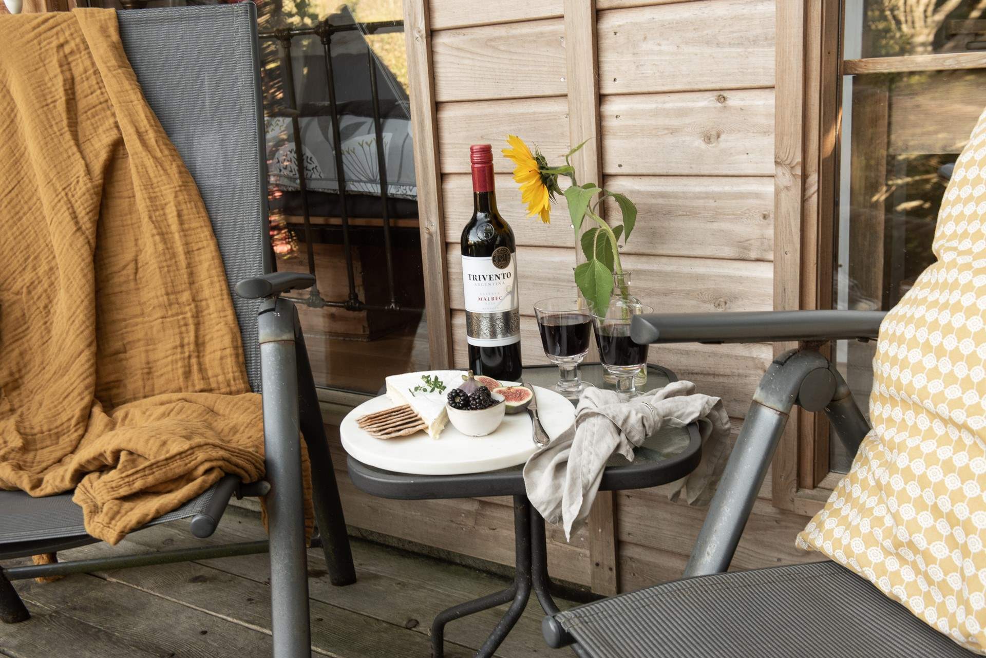 Tuck into a tasty cheese board and unwind with a rich glass of red. 