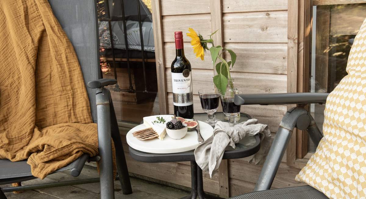 Tuck into a tasty cheese board and unwind with a rich glass of red. 