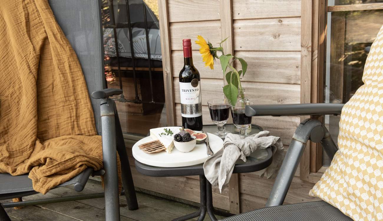 Tuck into a tasty cheese board and unwind with a rich glass of red. 