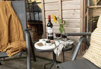 Tuck into a tasty cheese board and unwind with a rich glass of red. 