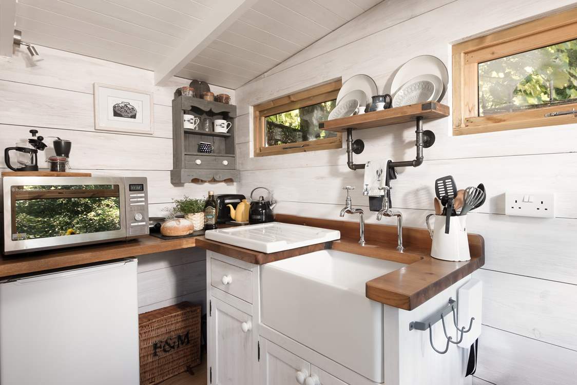 The kitchen is perfectly equipped for your getaway amongst the trees.