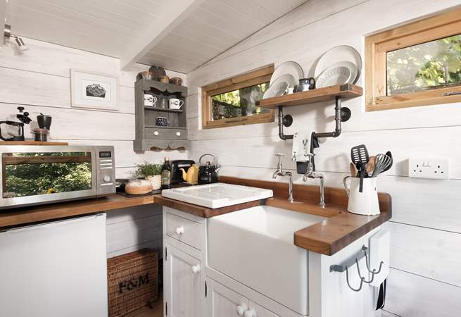 The kitchen is perfectly equipped for your getaway amongst the trees. 