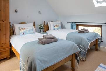 The delightful twin room is a great bedroom for both young and old, especially as it has a spacious en suite with bath and fitted shower.