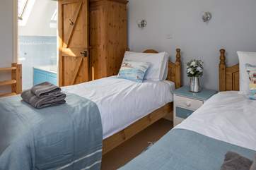 Bedroom 3 offers two single beds with an en suite.