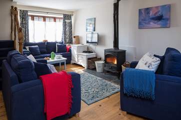Snuggling up in front of the wood-burner is a must after a day of adventure.