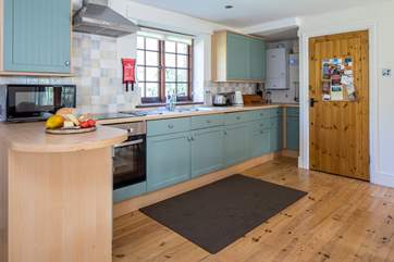 The large and well-equipped kitchen makes rustling up any meal a pleasure.