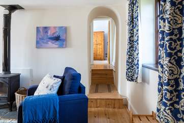 Bedroom 1 is tucked away at the end of this hallway. Please mind the steps.