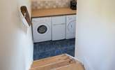 The utility-room houses the washing machine and tumble-drier. The small fridge/freezer pictured is being replaced by a large freestanding fridge/freezer for 2023. - Thumbnail Image