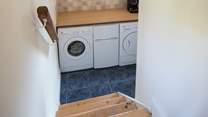 The utility-room houses the washing machine and tumble-drier. The small fridge/freezer pictured is being replaced by a large freestanding fridge/freezer for 2023.