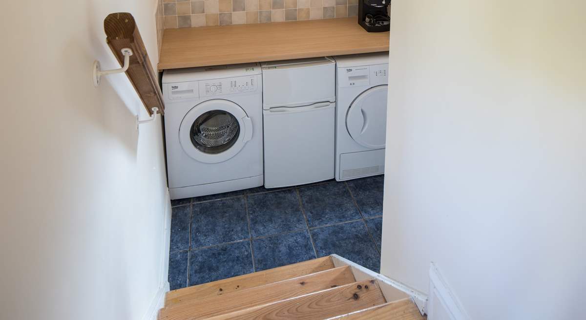 The utility-room houses the washing machine and tumble-drier. The small fridge/freezer pictured is being replaced by a large freestanding fridge/freezer for 2023.