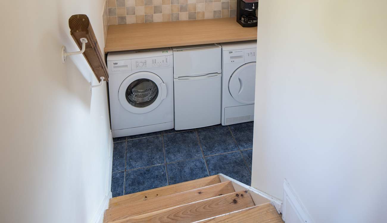 The utility-room houses the washing machine and tumble-drier. The small fridge/freezer pictured is being replaced by a large freestanding fridge/freezer for 2023.