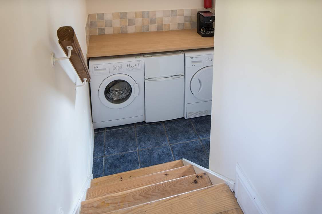 The utility-room houses the washing machine and tumble-drier. The small fridge/freezer pictured is being replaced by a large freestanding fridge/freezer for 2023.