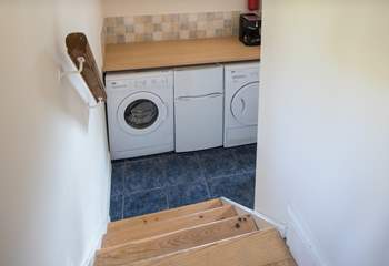 The utility-room houses the washing machine and tumble-drier. The small fridge/freezer pictured is being replaced by a large freestanding fridge/freezer for 2023.