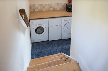 The utility-room houses the washing machine and tumble-drier. The small fridge/freezer pictured is being replaced by a large freestanding fridge/freezer for 2023.