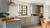 The large and well-equipped kitchen makes rustling up any meal a pleasure.