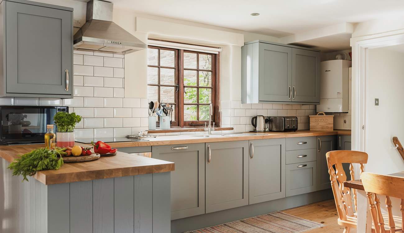 The large and well-equipped kitchen makes rustling up any meal a pleasure.