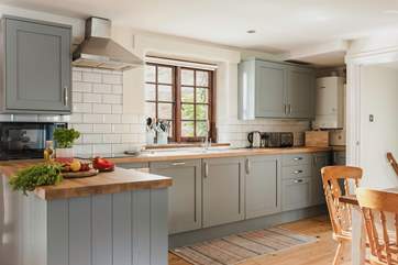 The large and well-equipped kitchen makes rustling up any meal a pleasure.