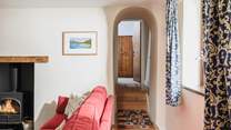 Bedroom 1 is tucked away at the end of this hallway. Please mind the steps.