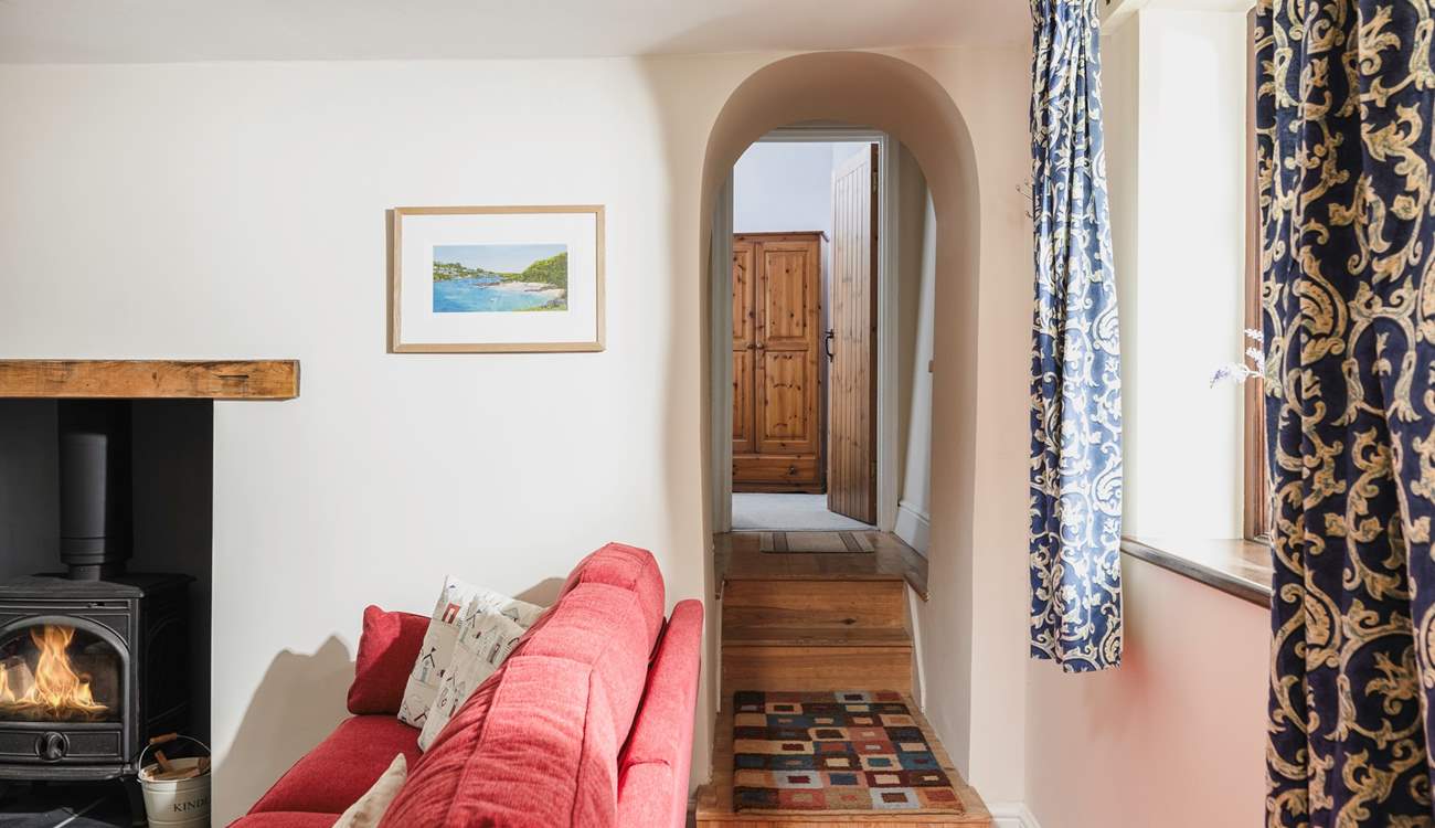 Bedroom 1 is tucked away at the end of this hallway. Please mind the steps.