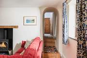 Bedroom 1 is tucked away at the end of this hallway. Please mind the steps.